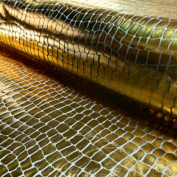 Lamé tissu crocodiles Doré