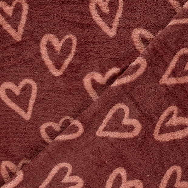 Coral Fleece tela Corazones estampado 