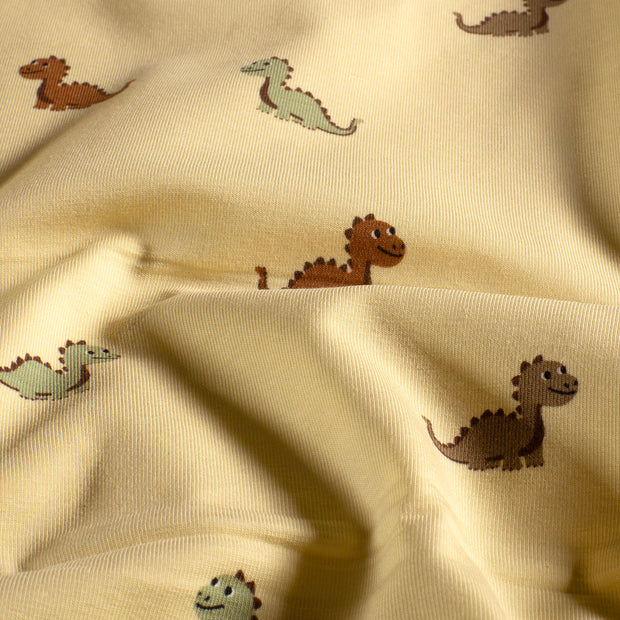 Jersey stof Dinosaurussen Beige